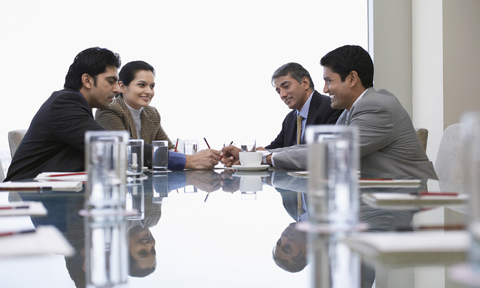 Employees animatedly participating in a workplace meeting(PC: DREAMSTIME.COM) 
